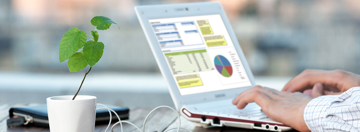 man typing on laptop keyboard