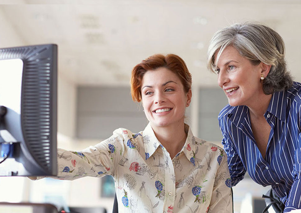 women looking at computer