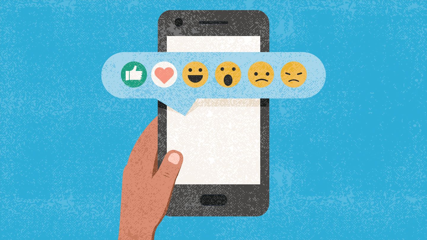 illustration of hand holding phone with emojis