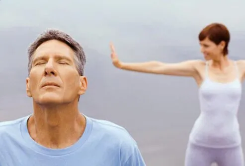 Photo of older couple exercising.