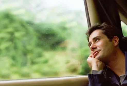 A man looking out a window.