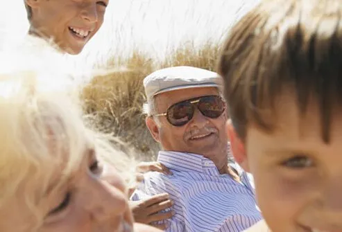 Grandparents at the beach with their grandchildren.