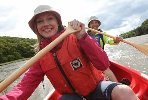 A couple canoeing together.