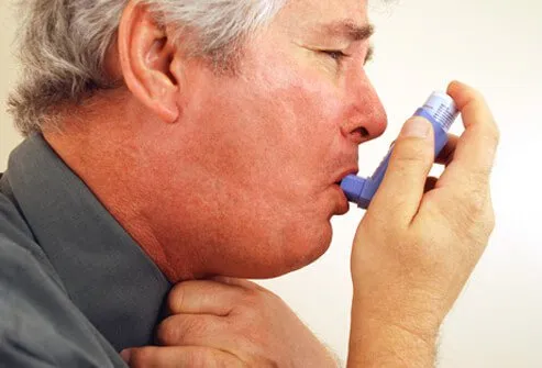 A man with chronic bronchitis using an inhaler.