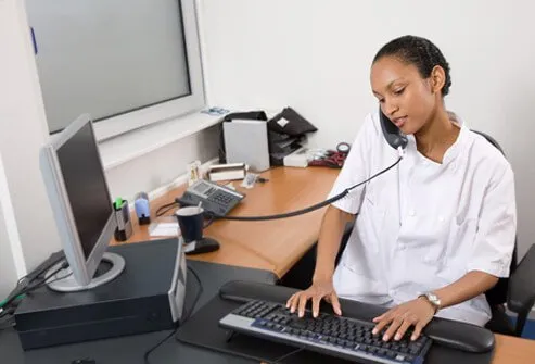 A nurse receiving a call for an appointment to see the doctor for bronchitis.