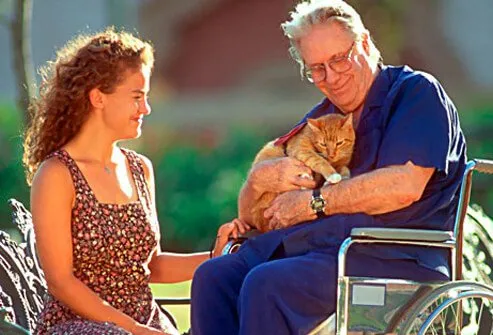 Photo of cat visiting senior home.