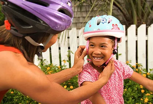 The best thing you can do to protect them from traumatic brain injuries is to get them a well-fitted helmet and instruct them in the rules of the road.