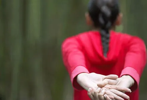 Woman streching her shoulder joints.