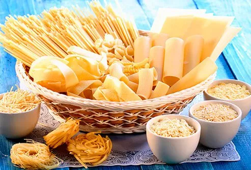 Basket and bowls of differenty types of gluten-free pasta.