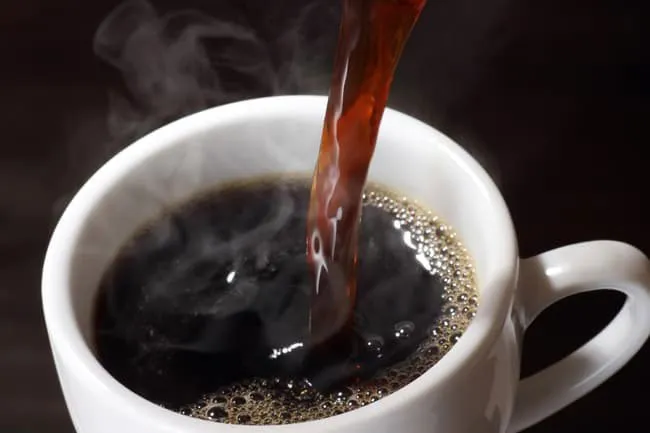 Hot-brewed black coffee is the healthiest because it has almost no calories or carbs, no fat, and is low in sodium. 