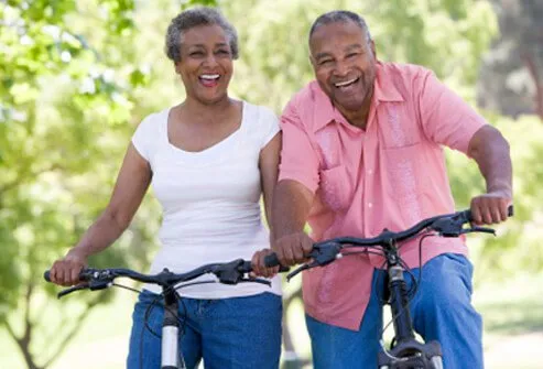 Senior couple enjoys a bike ride.