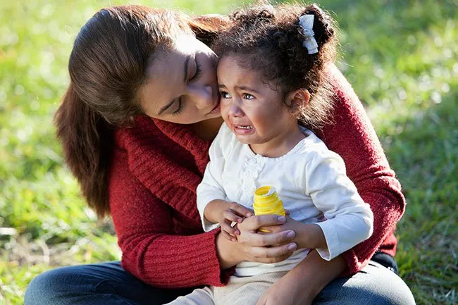 Some children will feel more secure and calm when held during a tantrum.