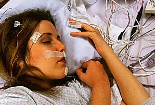 Photo of a woman undergoing a sleep study.