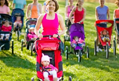 A group of mothers with their babies in strollers.