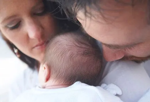 Parents with their newborn baby.