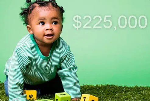 A baby girl playing with blocks.