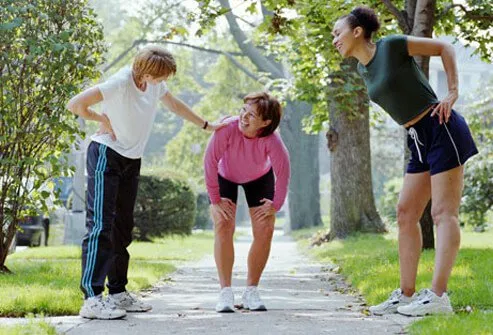 A group of women rest in between their exercise.