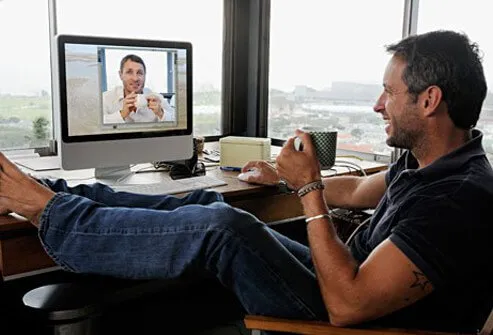 Photo of two men in video conference call.