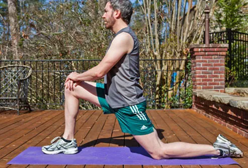 If you have low back pain, warm up by gently stretching your hips before working out.