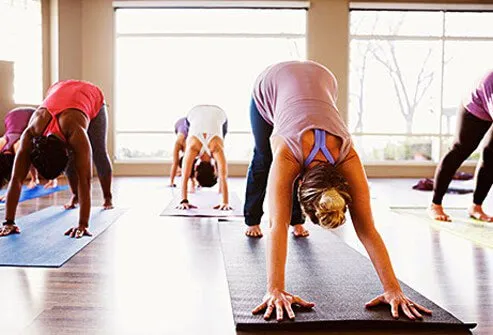 Women active in a yoga class.