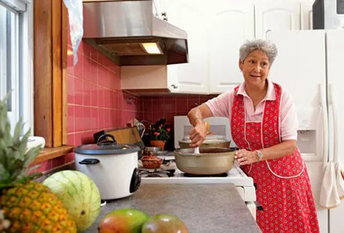 A rehabilitated stroke victim cooking at home.