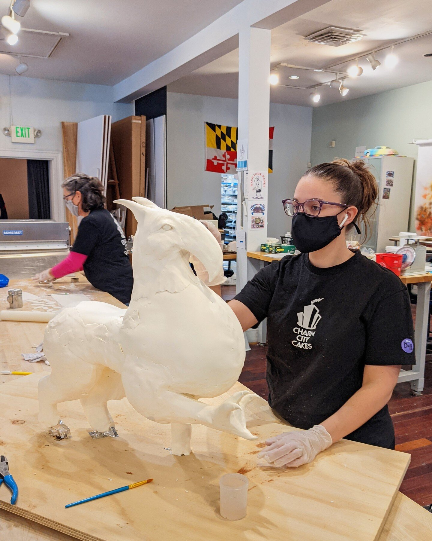 Throwback to an in process shot of this awesome griffin cake we made last year! This cake focused heavily on the use of modeling chocolate and edible oil paints. 

#griffin #sculptedcake #magic #birthdaycake #charmcitycakes #aceofcakes #cakefun #duff