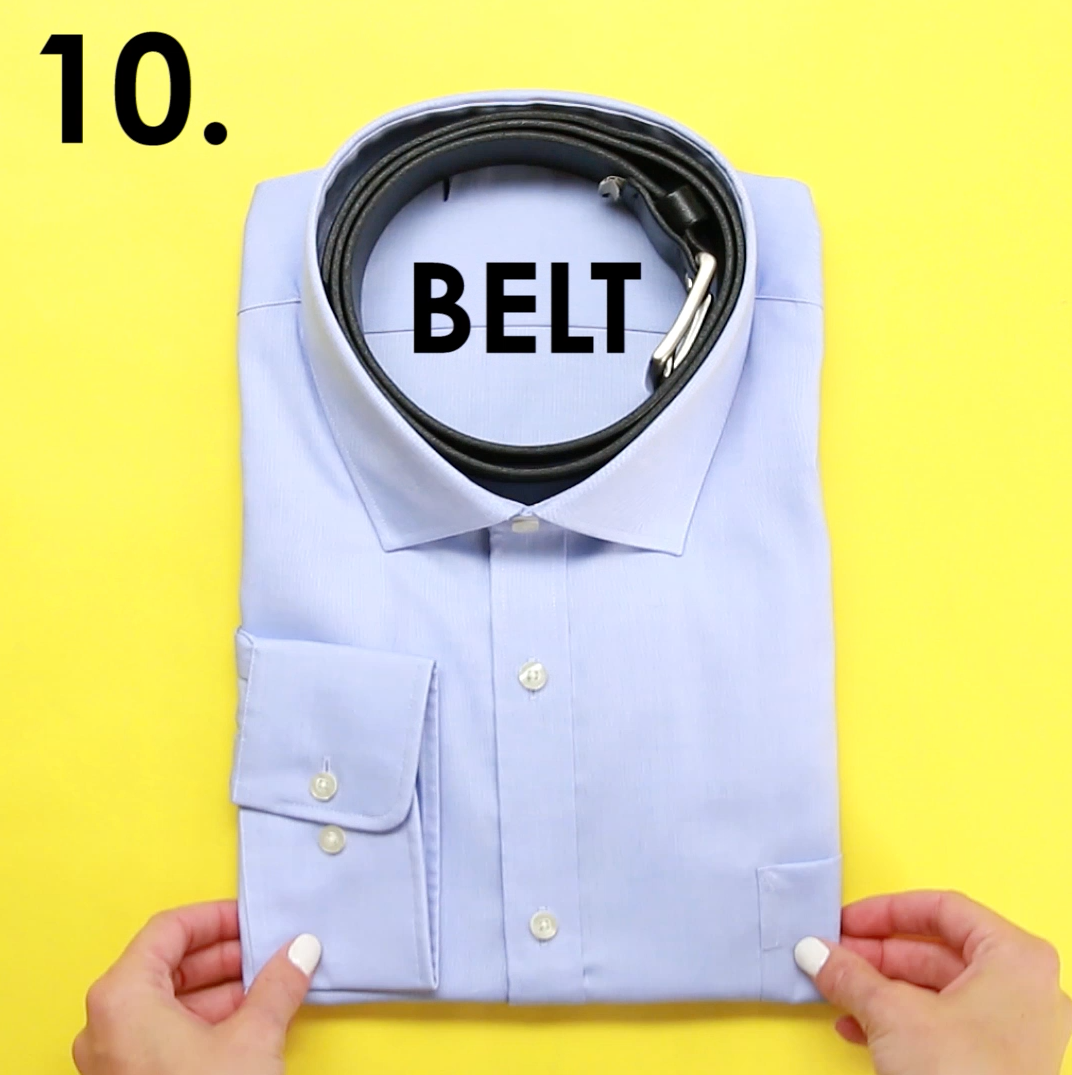 A collared shirt with a belt rolled up to fit inside the neckhole