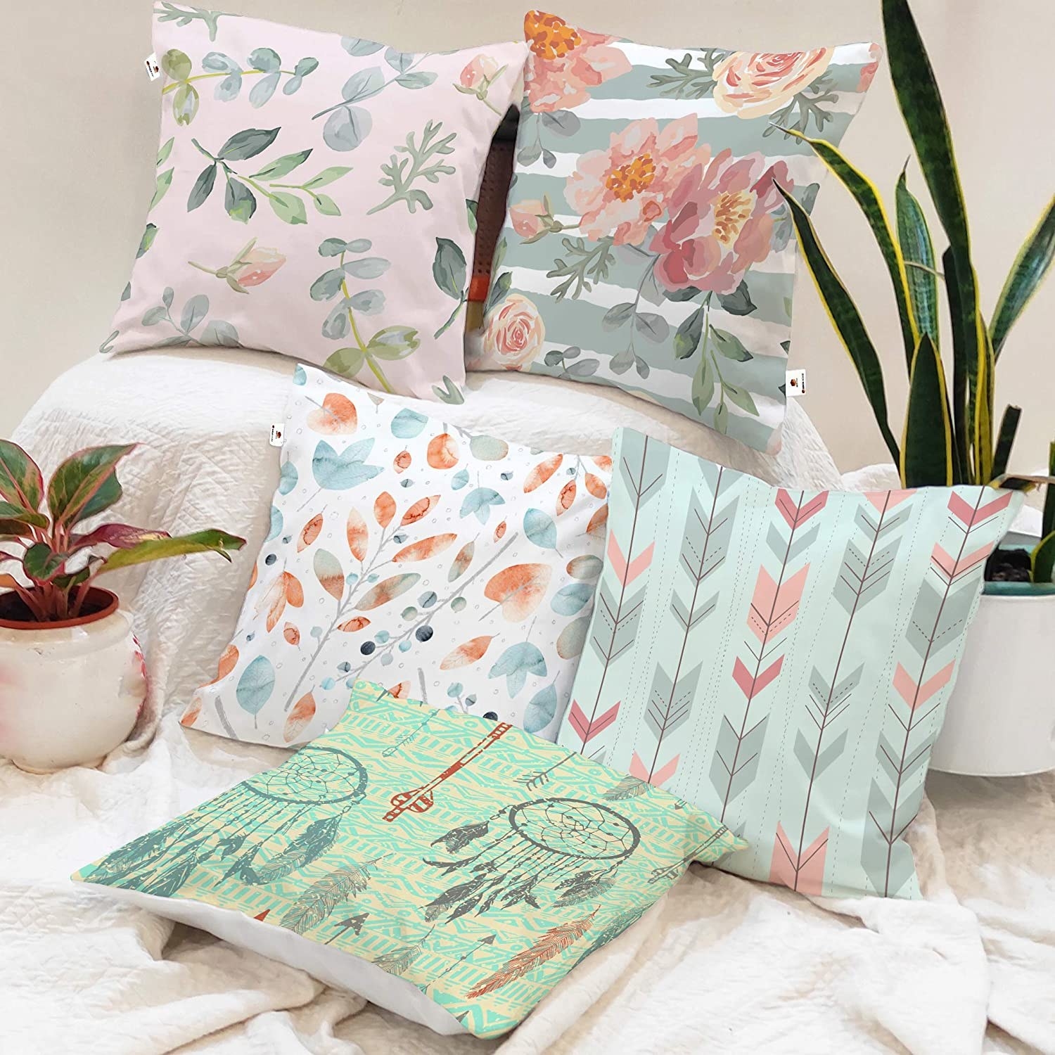 Colorful cushions on a white blanket