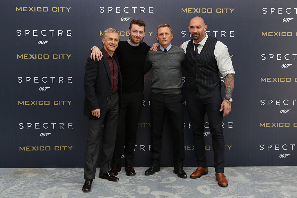 Sam Smith poses with the cast of Spectre