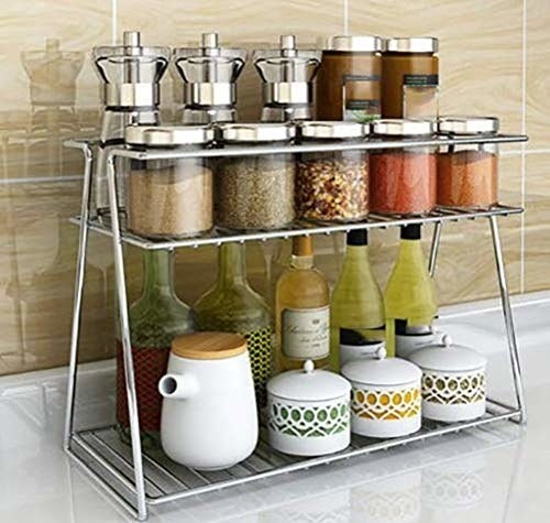 A two-tier organiser with condiments, bottles and jars on it