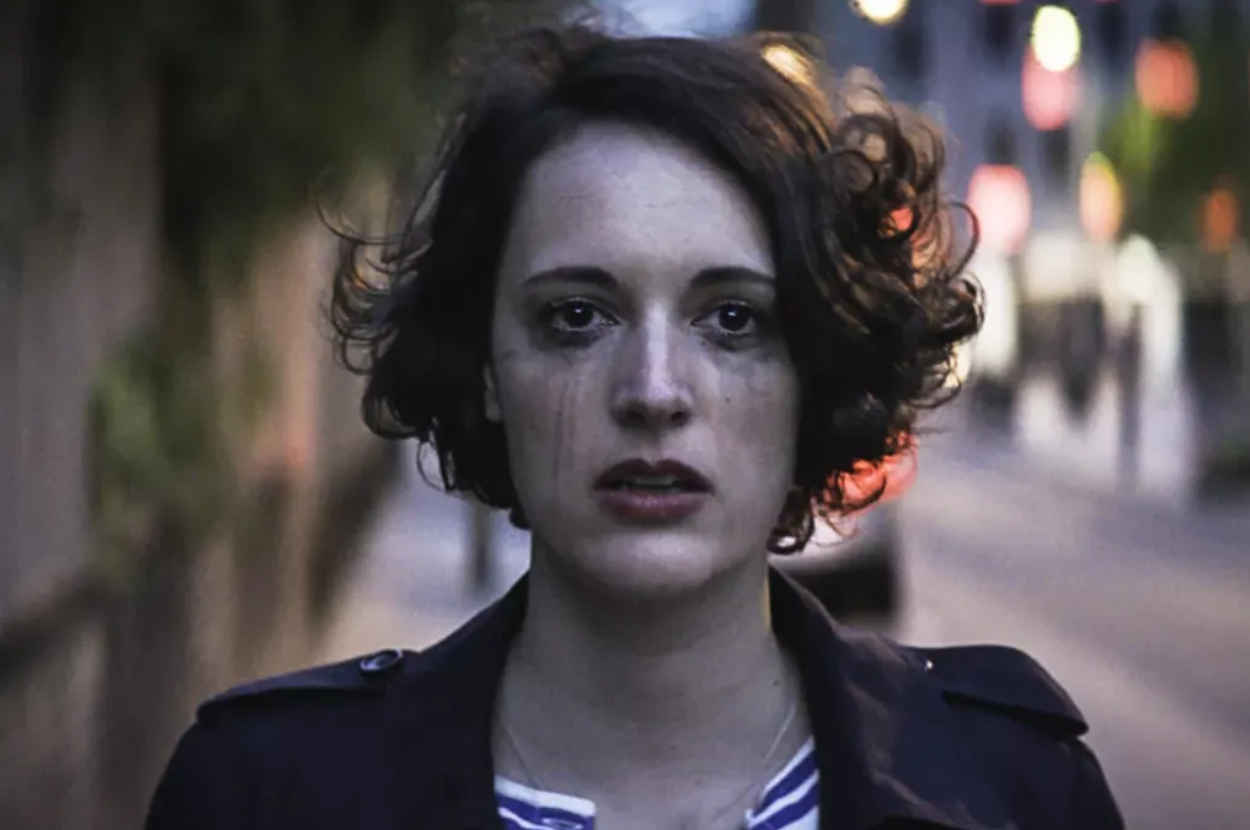 Phoebe Waller-Bridge with teary eyes and smeared mascara, staring ahead in a somber scene from &quot;Fleabag.&quot;