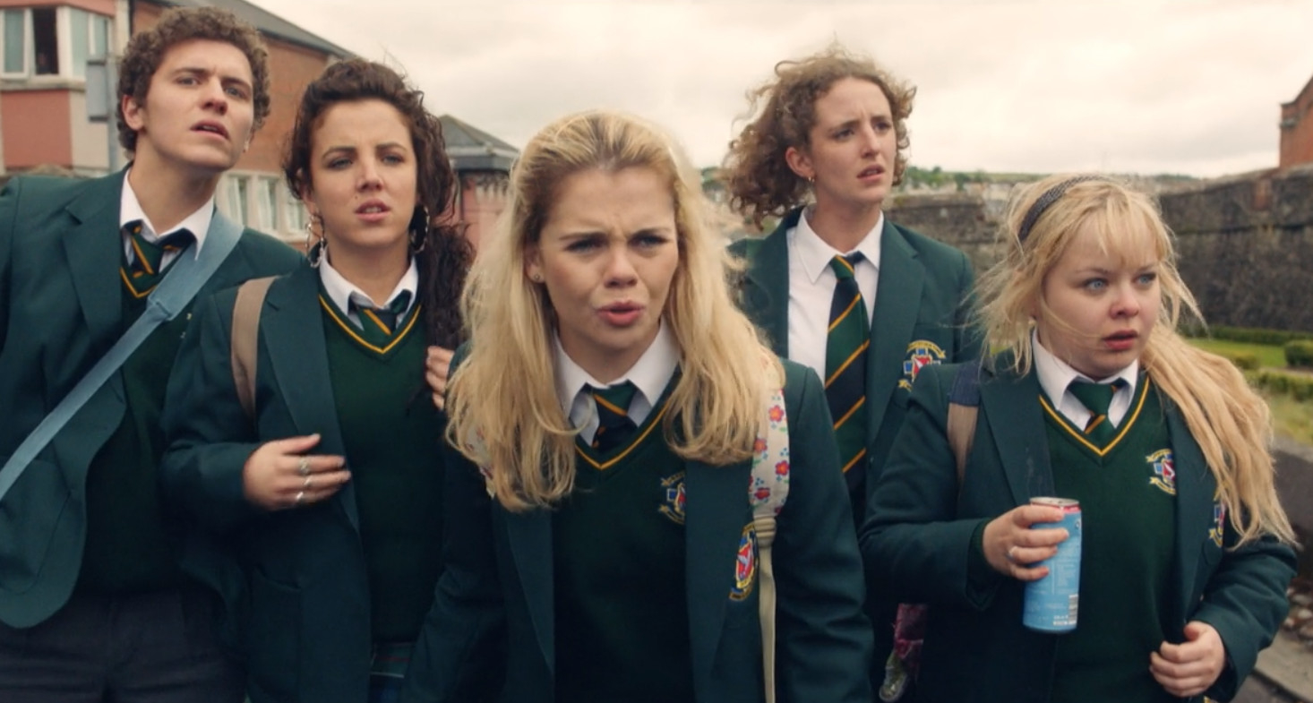 Actors in school uniforms look concerned in a scene from the TV show &quot;Derry Girls.&quot;