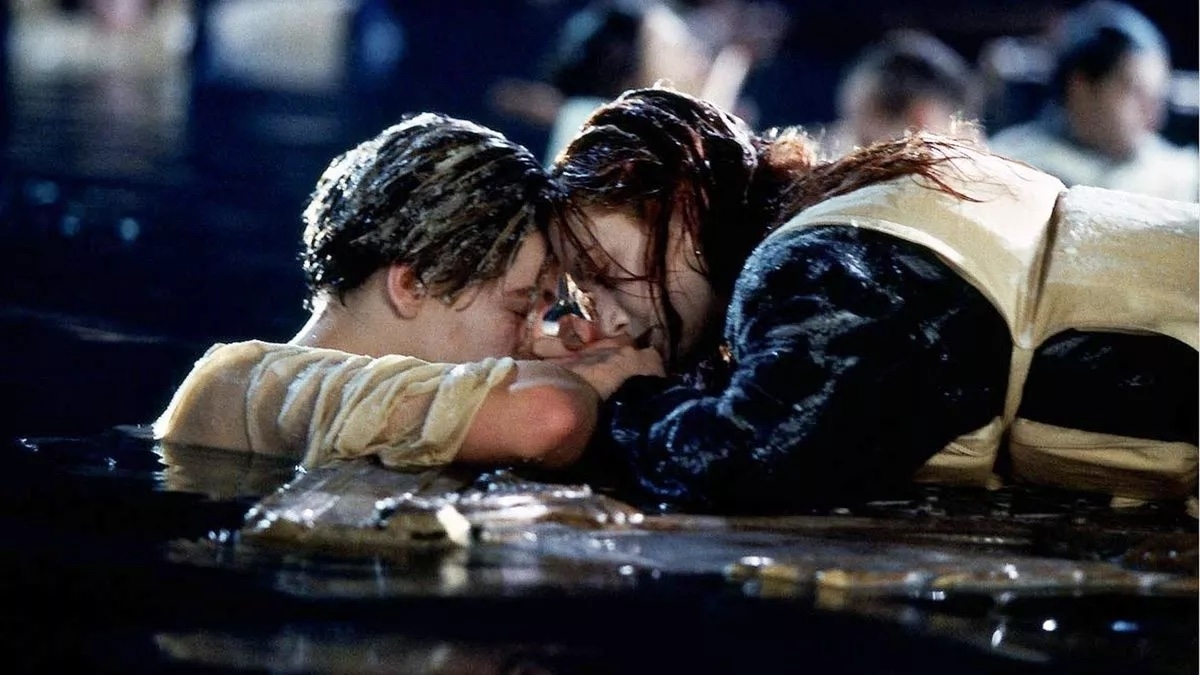 Leonardo DiCaprio and Kate Winslet clinging to debris in the water in a scene from Titanic