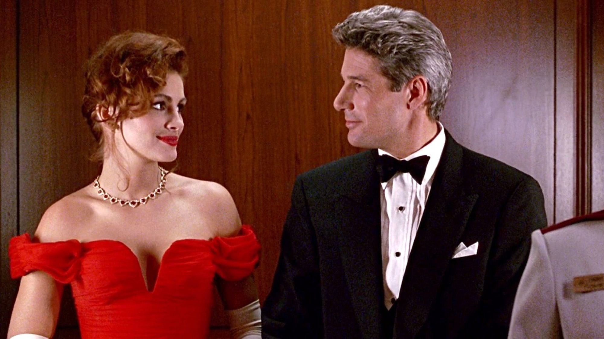 Julia Roberts in an elegant off-the-shoulder gown and Richard Gere in a tuxedo share a moment in a scene from &quot;Pretty Woman.&quot;