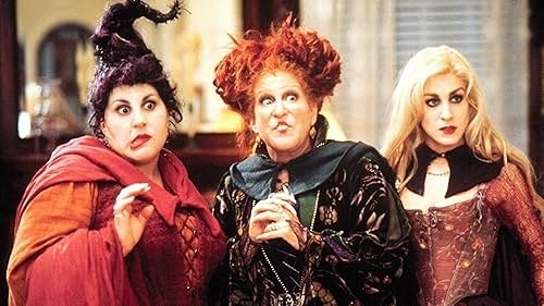 Kathy Najimy, Bette Midler, and Sarah Jessica Parker dressed as their characters from the film &quot;Hocus Pocus,&quot; in elaborate, theatrical witch costumes