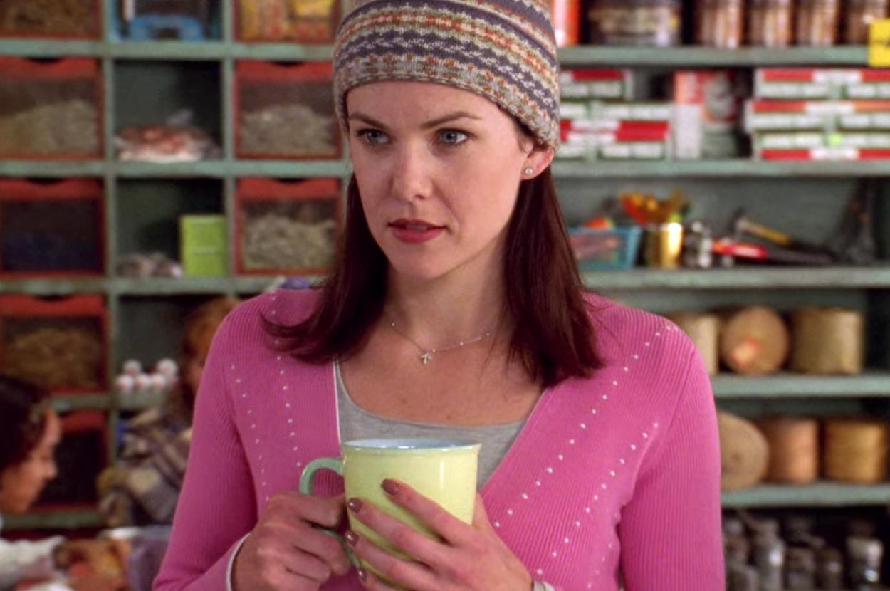 Lorelai from New Girl holding a coffee mug