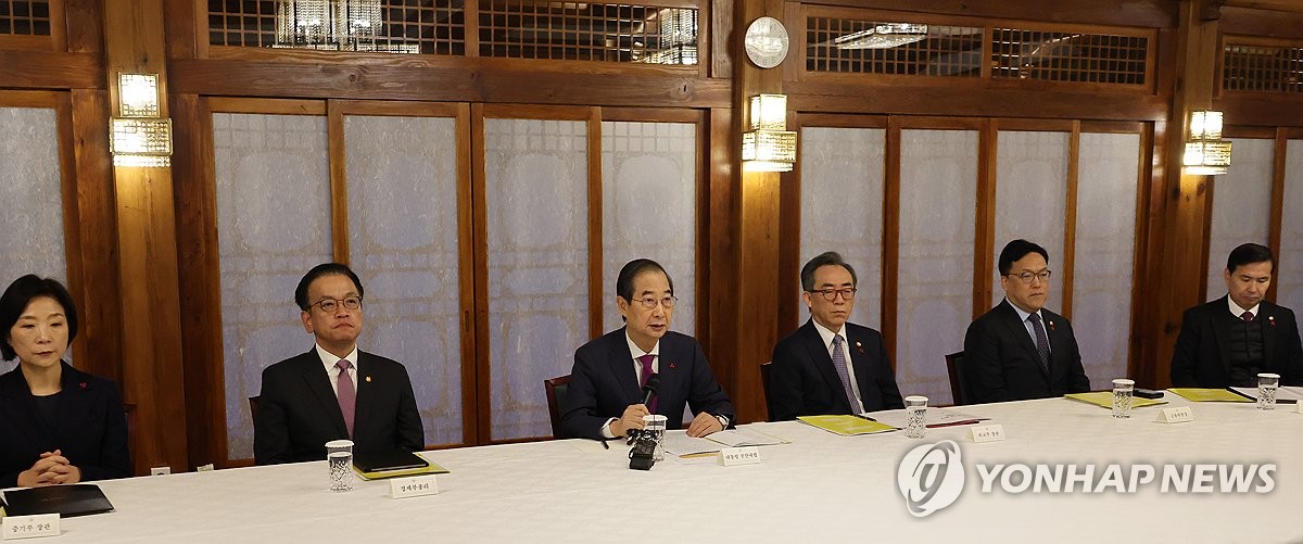 Acting President Han Duck-soo (3rd from L) speaks during a meeting of senior government and ruling party officials at his official residence in Seoul on Dec. 20, 2024. (Yonhap)