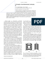 Microwave Transmission Through A Two-Dimensional, Isotropic, Left-Handed Metamaterial