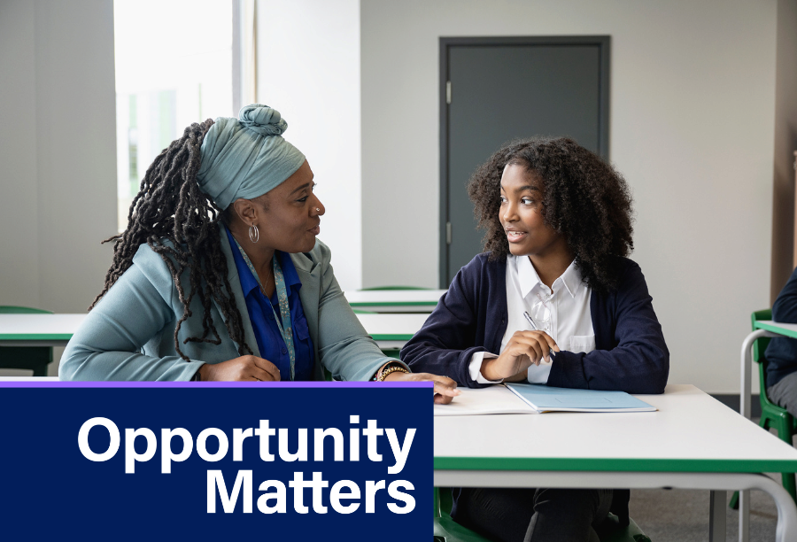 Two individuals sitting at a table, engaged in conversation, with "Opportunity Matters" text overlay.