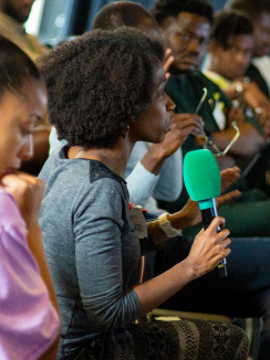 A girl speaking on mic