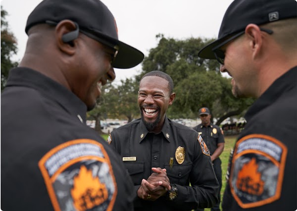 Royal laughing with other members of The Forestry and Fire Recruitment Program.