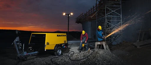 Men working with Kaeser Compressor equipment