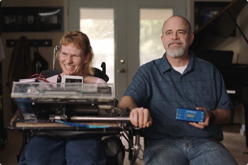 Developer Tania Finlayson and her partner Ken posing with their Morse code keyboard device.