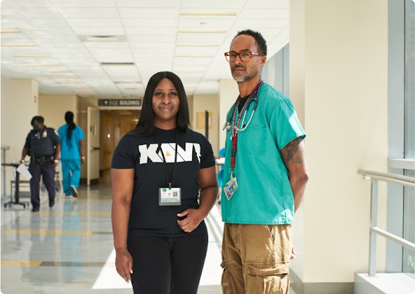 Taisha with KAVI founder, Dr. Robert Gore, at the Kings County Hospital in Brooklyn.