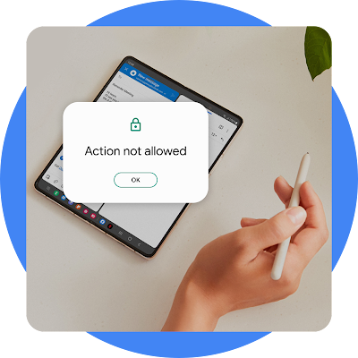 An open phone sits next to a hand holding a stylus with a graphic displaying the words action not allowed.