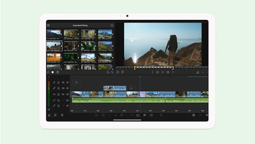 A tablet displaying a video editing screen with hiking footage on the Lumafusion app.