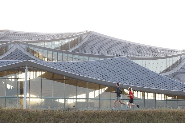 Two men running past the Bay View building.