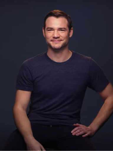 David ‘DJ’ Kurs, an actor who is deaf and the artistic director of Deaf West Theatre, poses smiling.