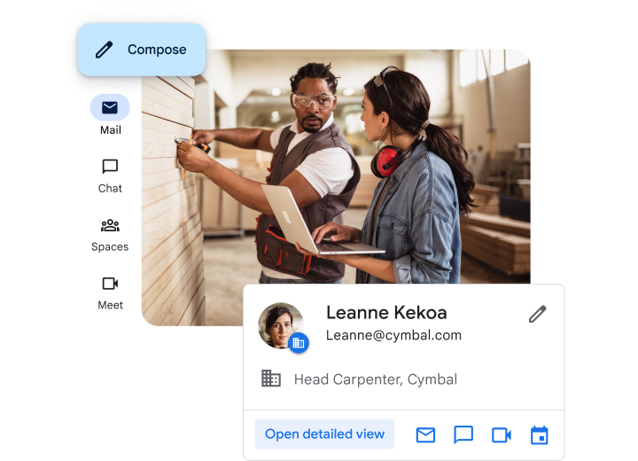 A woman with a laptop talking to a colleague in a carpentry workshop about creating a business email address with Gmail and Google Workspace.