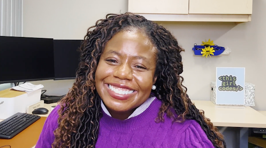 Tonya smiling warmly at her office desk